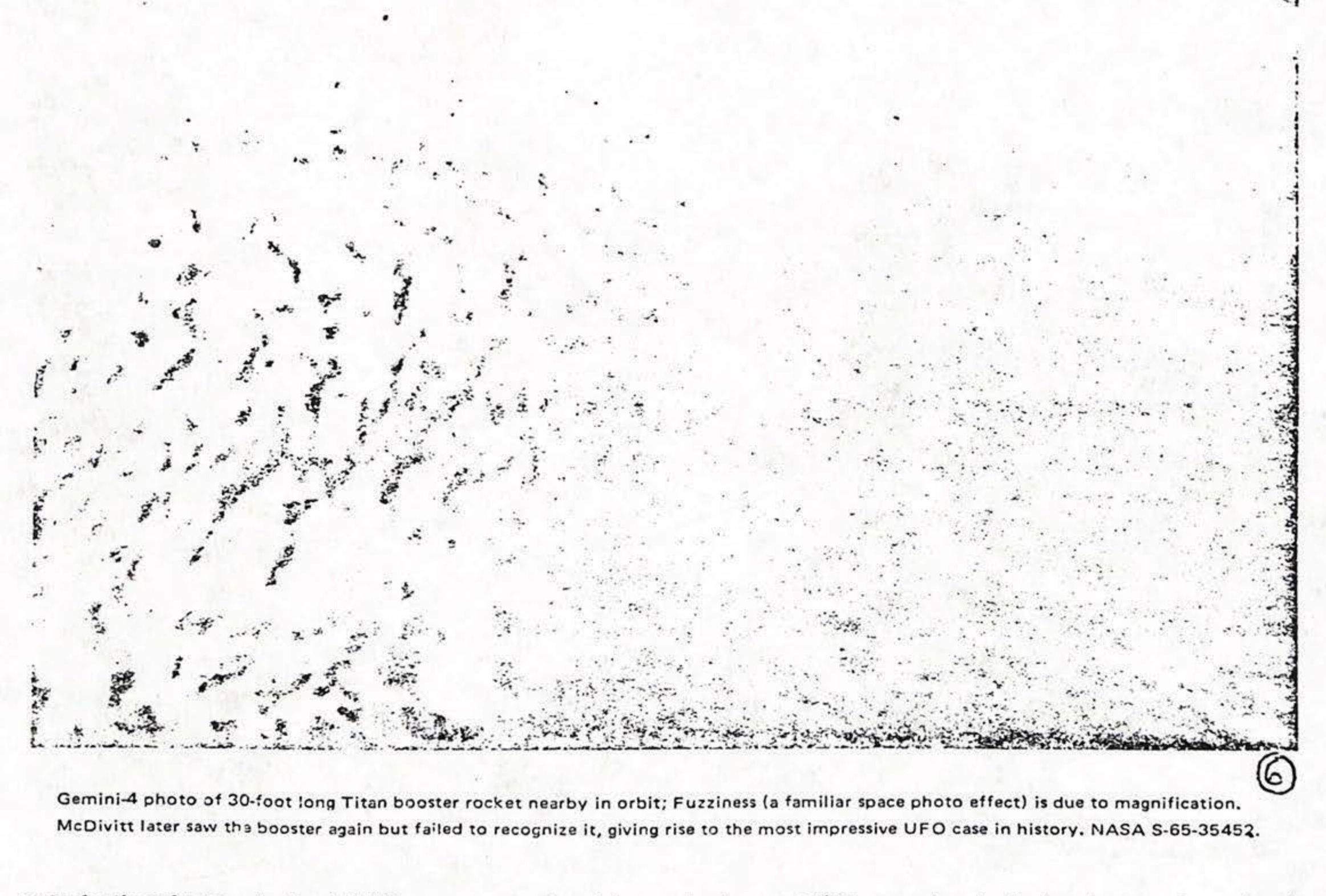 Gemini-4 photo of 30-foot long Titan booster rocket nearby in orbit; Fuzziness (a familiar space photo effect) is due to magnification. McDivitt later saw the booster again but failed to recognize it, giving rise to the most impressive UFO case in history. NASA S-65-35452.