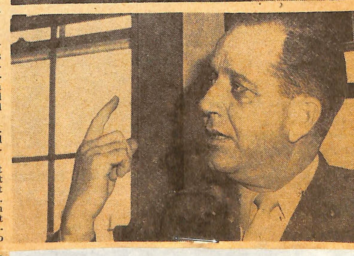 Photo of a man pointing.