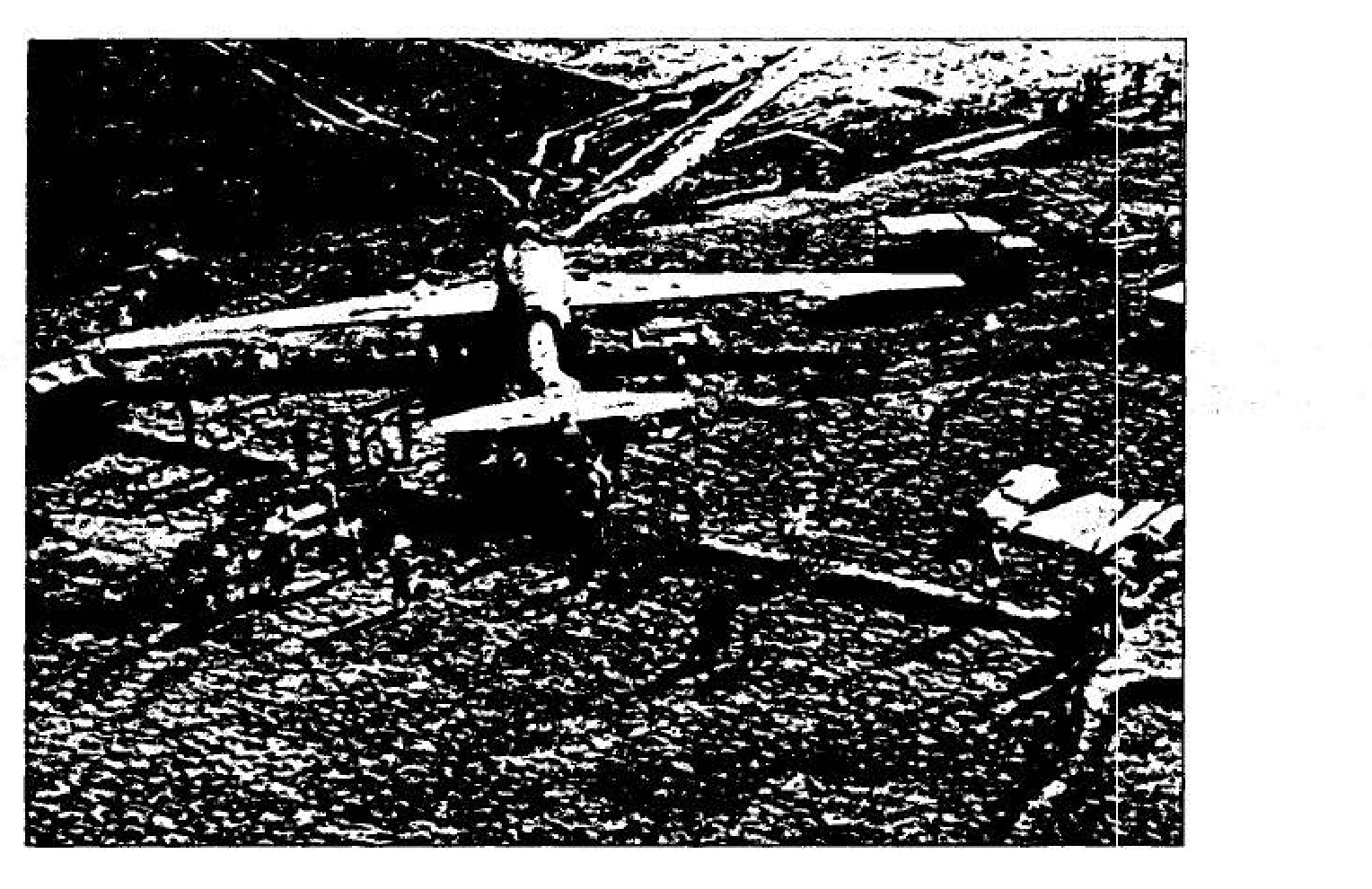 A helicopter lifts wreckage of a U-2.