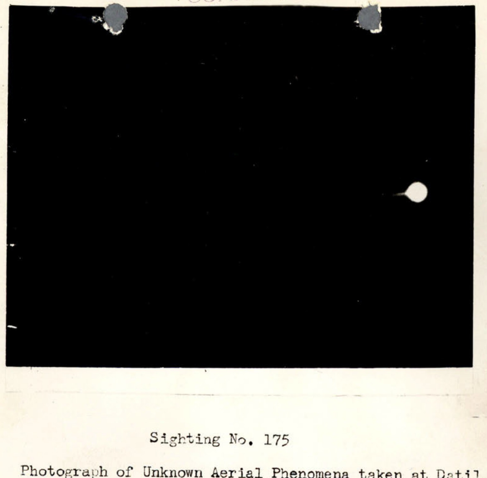 Photograph of Unknown Aerial Phenomena showing luminous object against dark sky