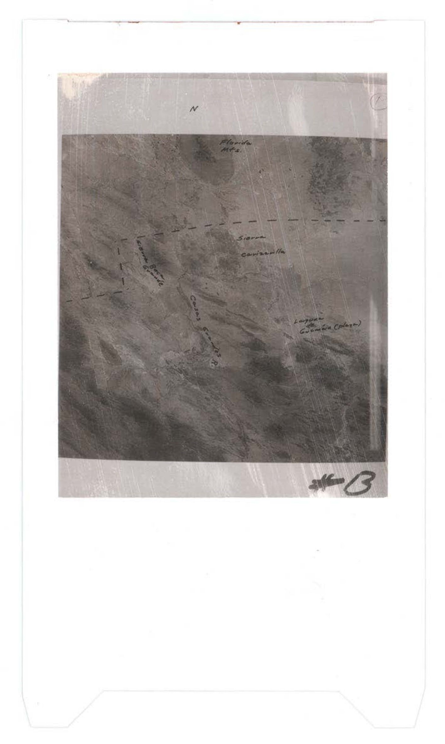 Aerial photograph with handwritten annotations indicating Florida location, storm contrails, and measurements