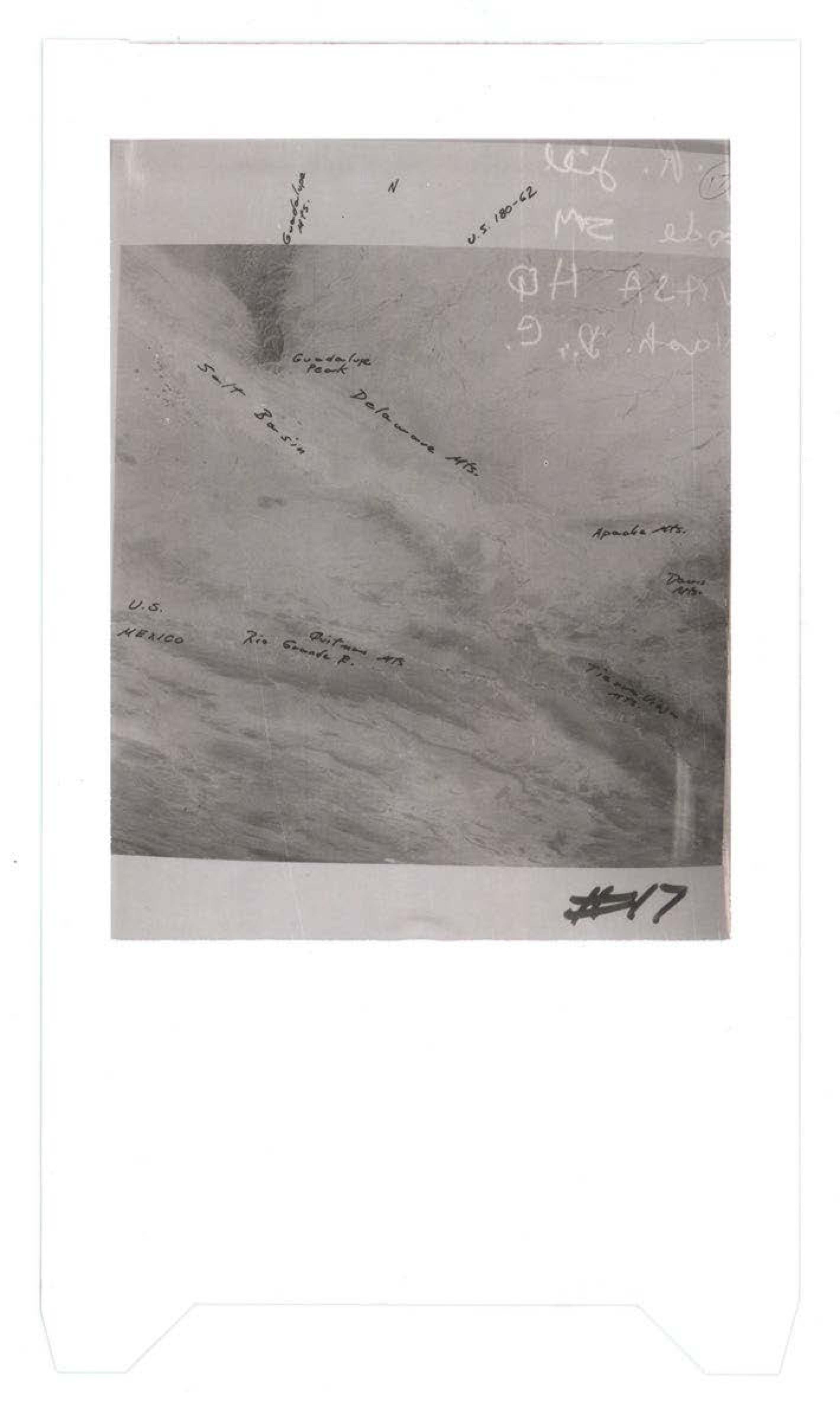 Aerial photograph showing mountainous terrain with handwritten geographic labels including Guadalupe Pass, Salt Basin, Delaware Mts, Apache Mts, and Texas State, marked as #17