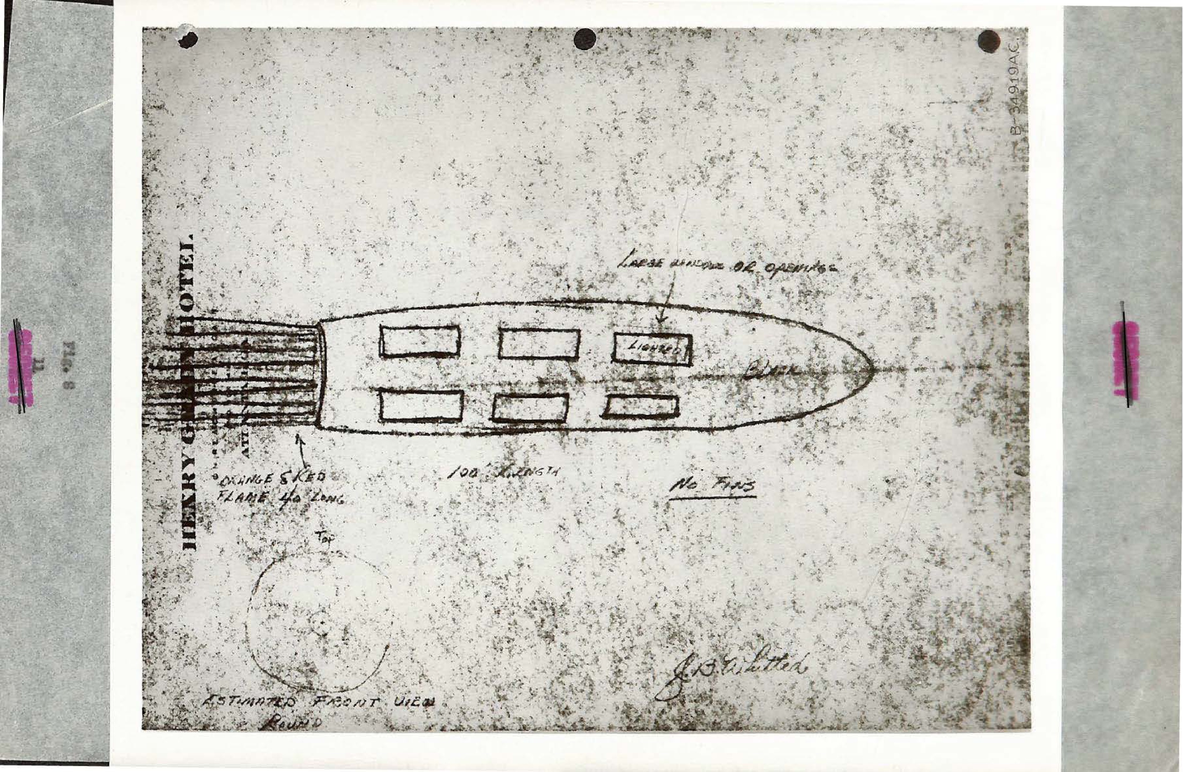 Photograph of a sketch of a cylindrical object with windows and a tail flame.