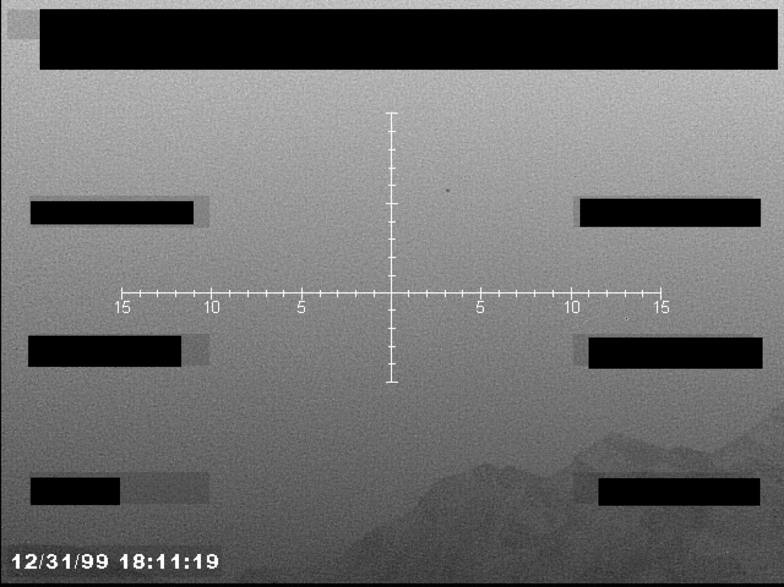 Sensor or gun camera view with a central crosshair reticle, timestamp, and multiple redactions.