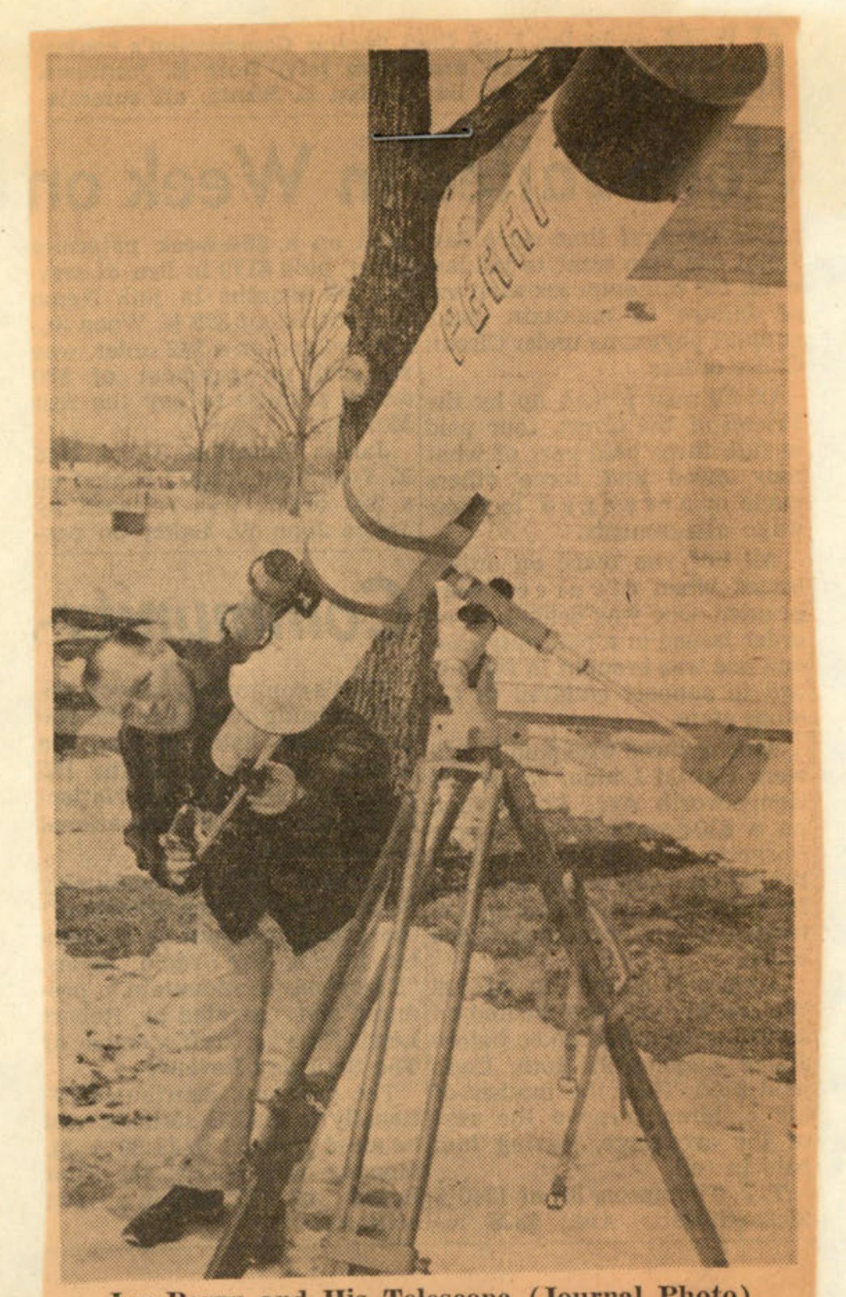 A black and white newspaper photograph showing a man, Joe Perry, standing next to a large, homemade telescope mounted on a tripod outdoors.